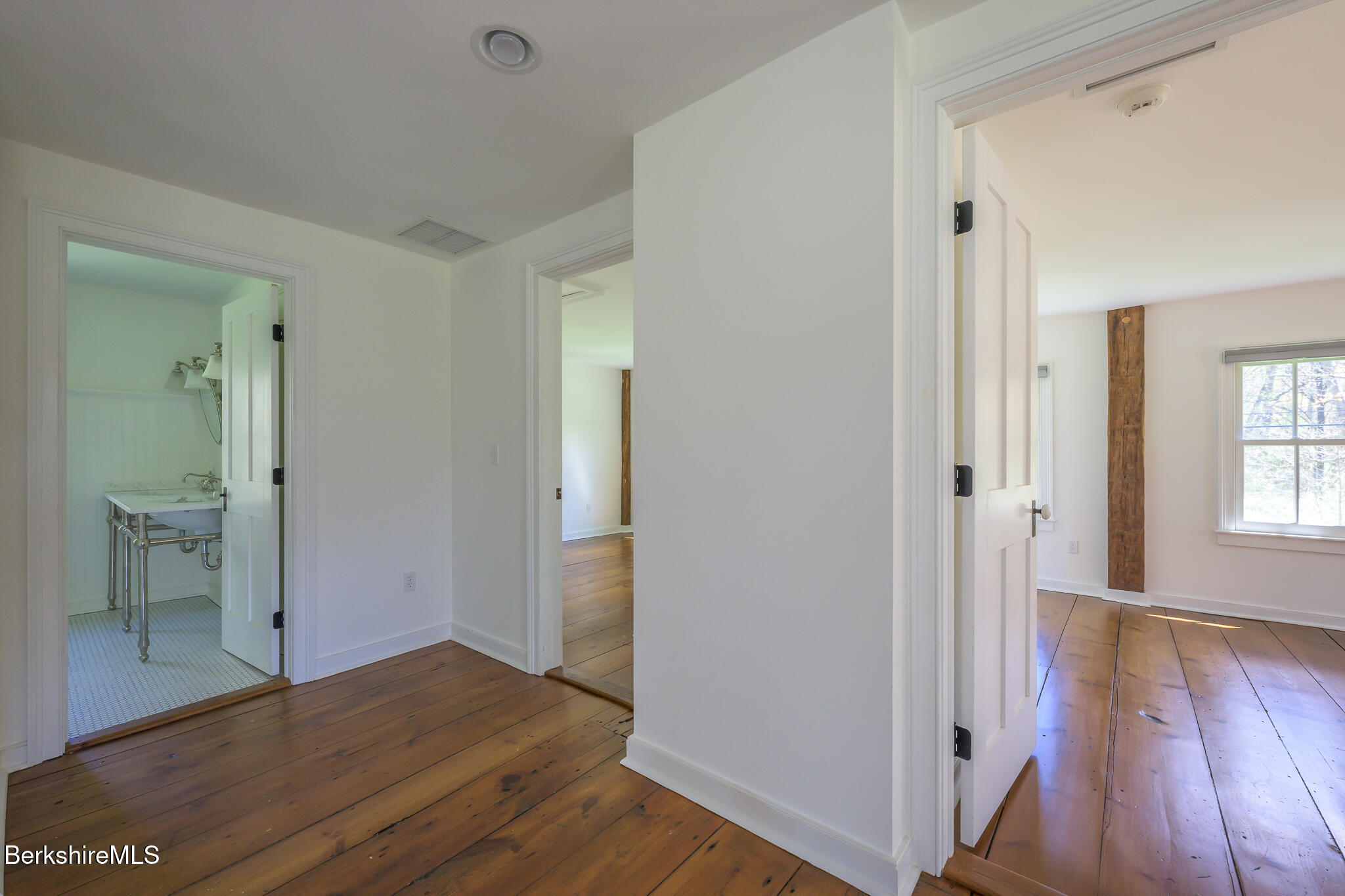 304 Hickey Hill Road Sheffield, MA 01257 - Photo 36 of 60 a view of wooden floor and windows in a room