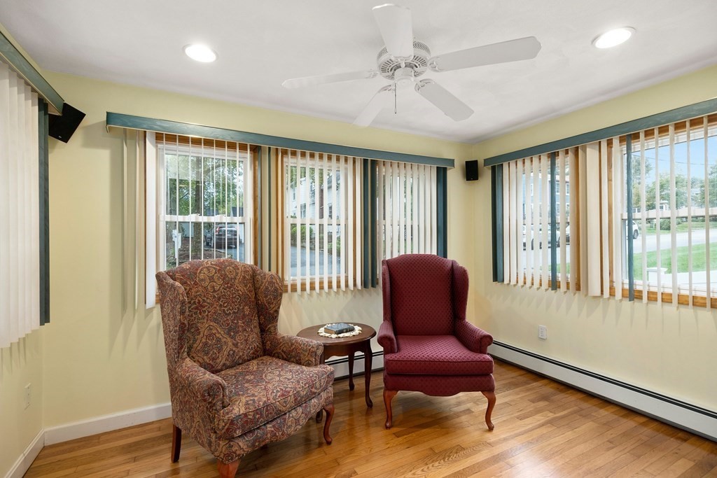 102 Orange Street Reading, MA 01867 - Photo 4 of 23 a living room with furniture and windows