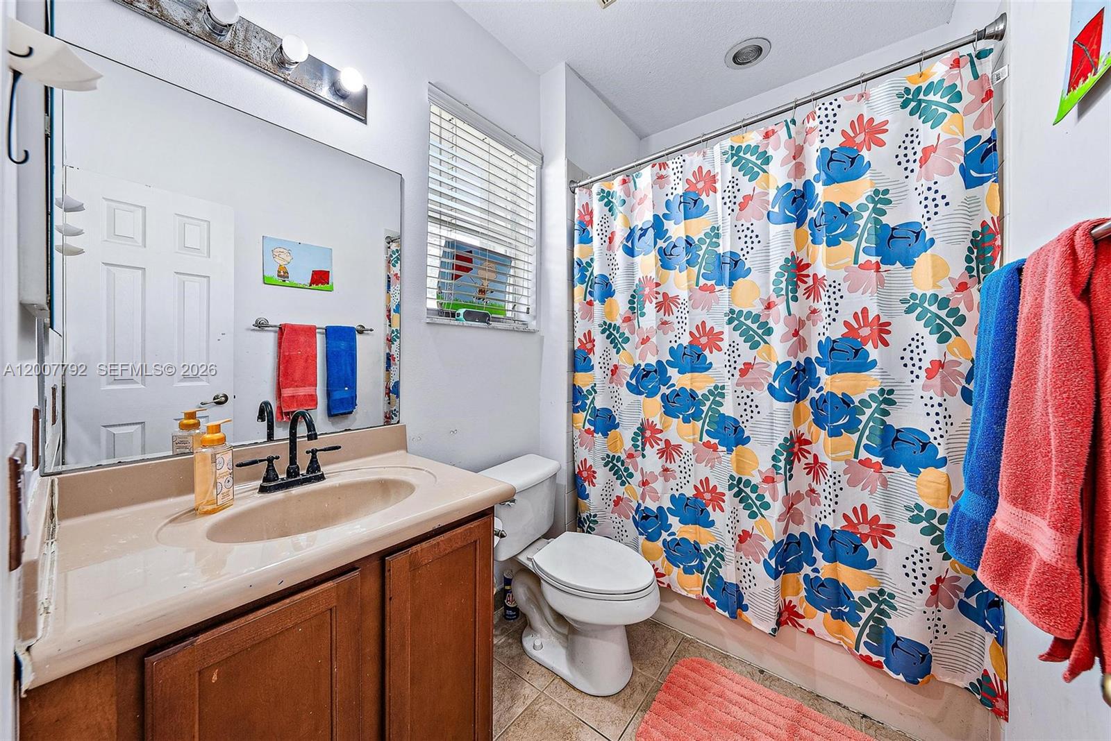 3229 Laurel Ridge Circle, Unit 3229 Riviera Beach, FL 33404 - Photo 13 of 24 a bathroom with a sink toilet and shower