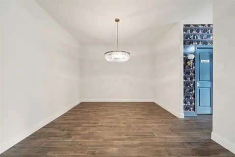 a view of a room with window and wooden floor