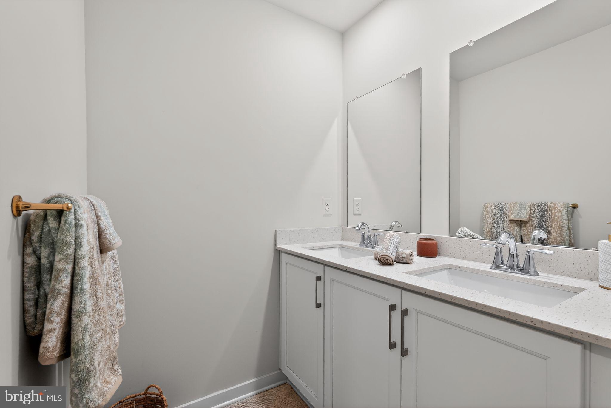 1017 Mariwill Drive Quakertown, PA 18951 - Photo 24 of 31 a bathroom with a double vanity sink and a mirror