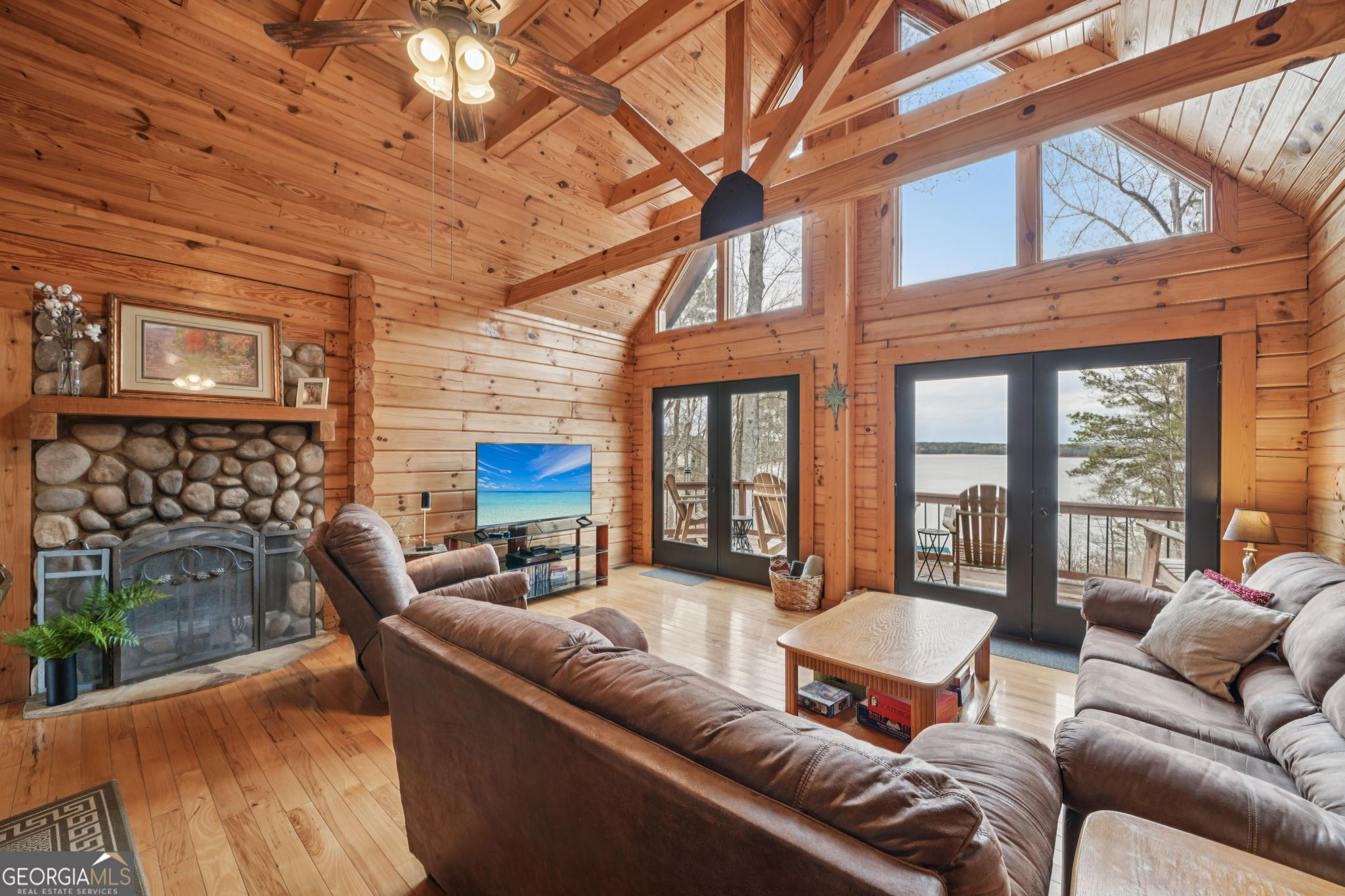 50 Eubanks Point Road Wedowee, AL 36278 - Photo 12 of 81 a living room with furniture a fireplace and a large window
