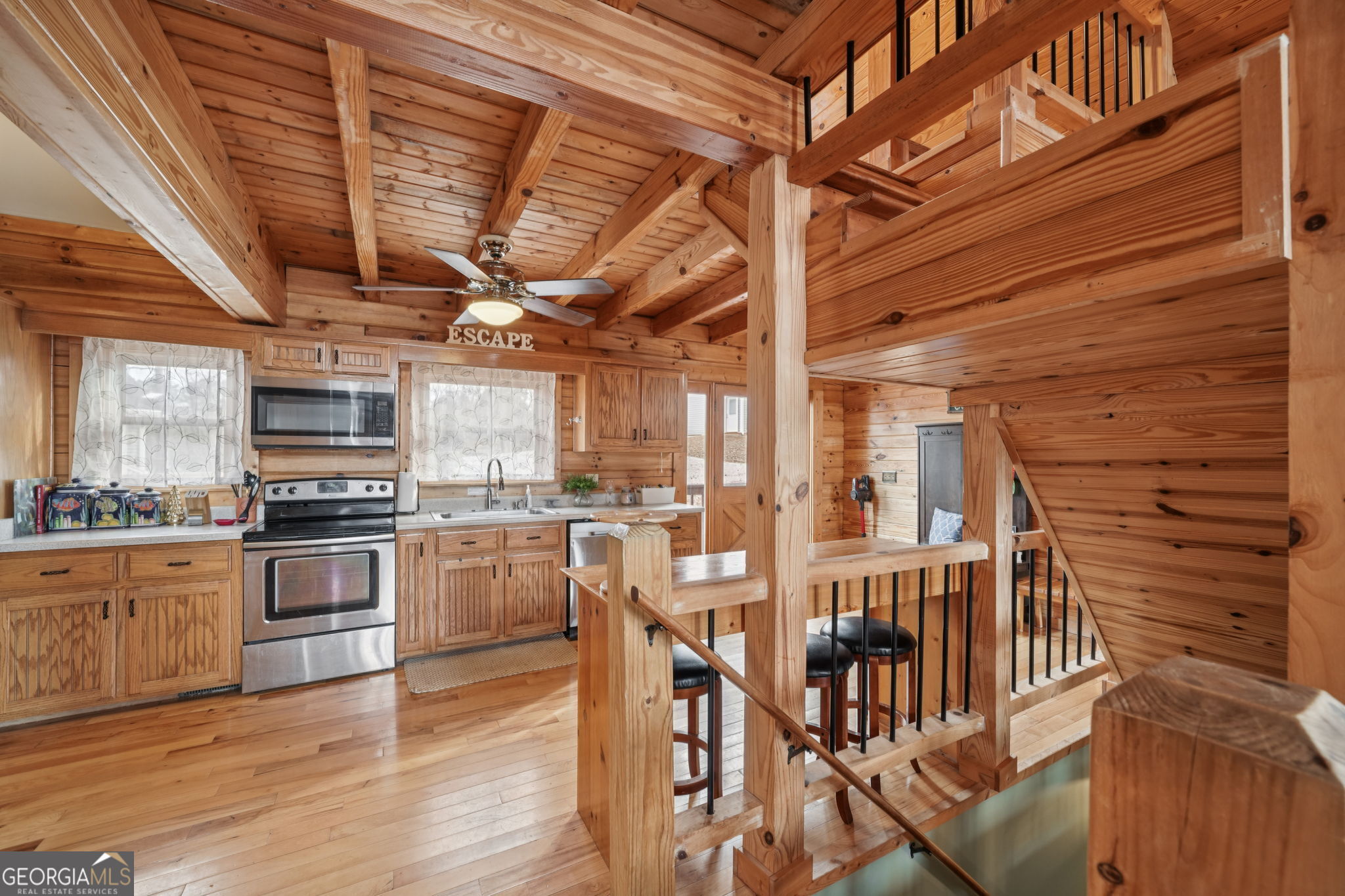50 Eubanks Point Road Wedowee, AL 36278 - Photo 21 of 81 a kitchen with stainless steel appliances granite countertop a stove and a refrigerator