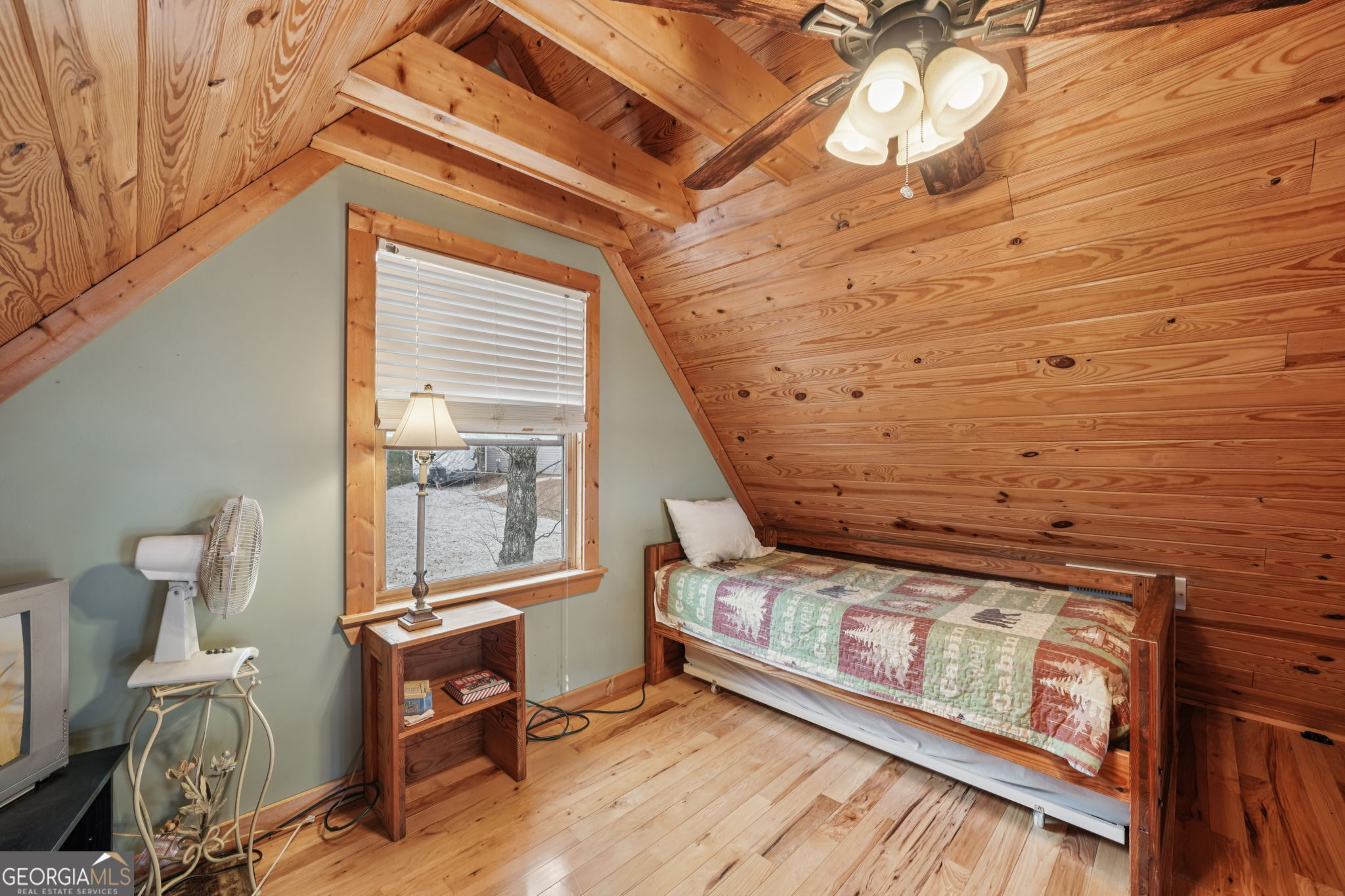 50 Eubanks Point Road Wedowee, AL 36278 - Photo 33 of 81 a view of an empty room with wooden floor and a window