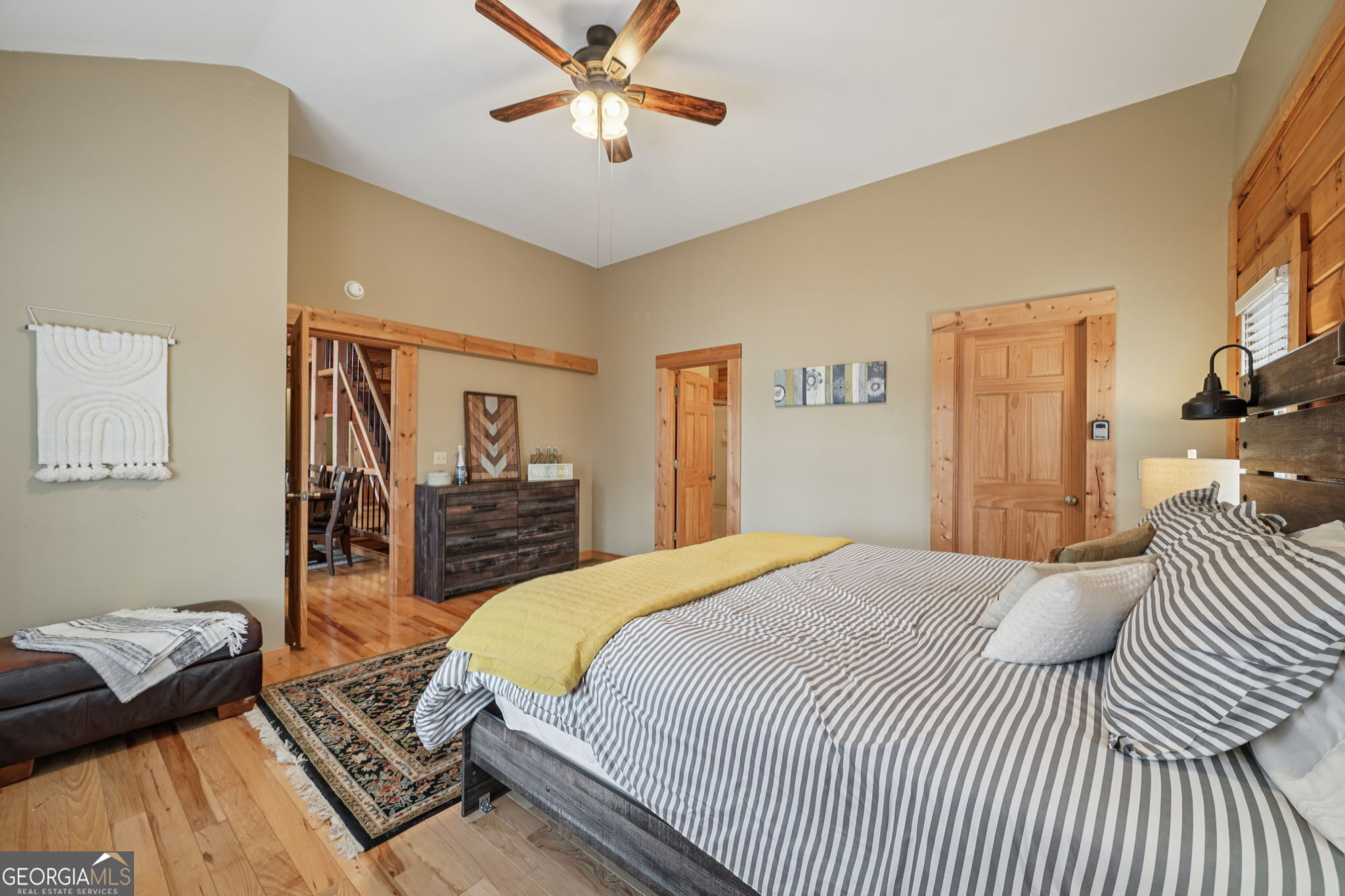 50 Eubanks Point Road Wedowee, AL 36278 - Photo 37 of 81 a bedroom with a bed and a chandelier