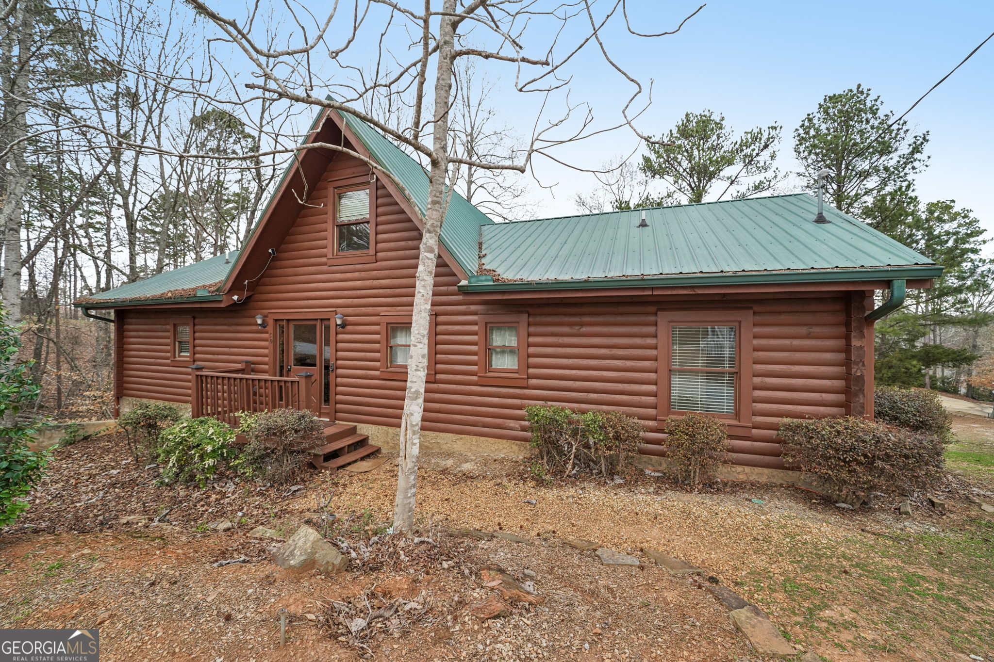 50 Eubanks Point Road Wedowee, AL 36278 - Photo 7 of 81 a backyard of a house with plants and large tree