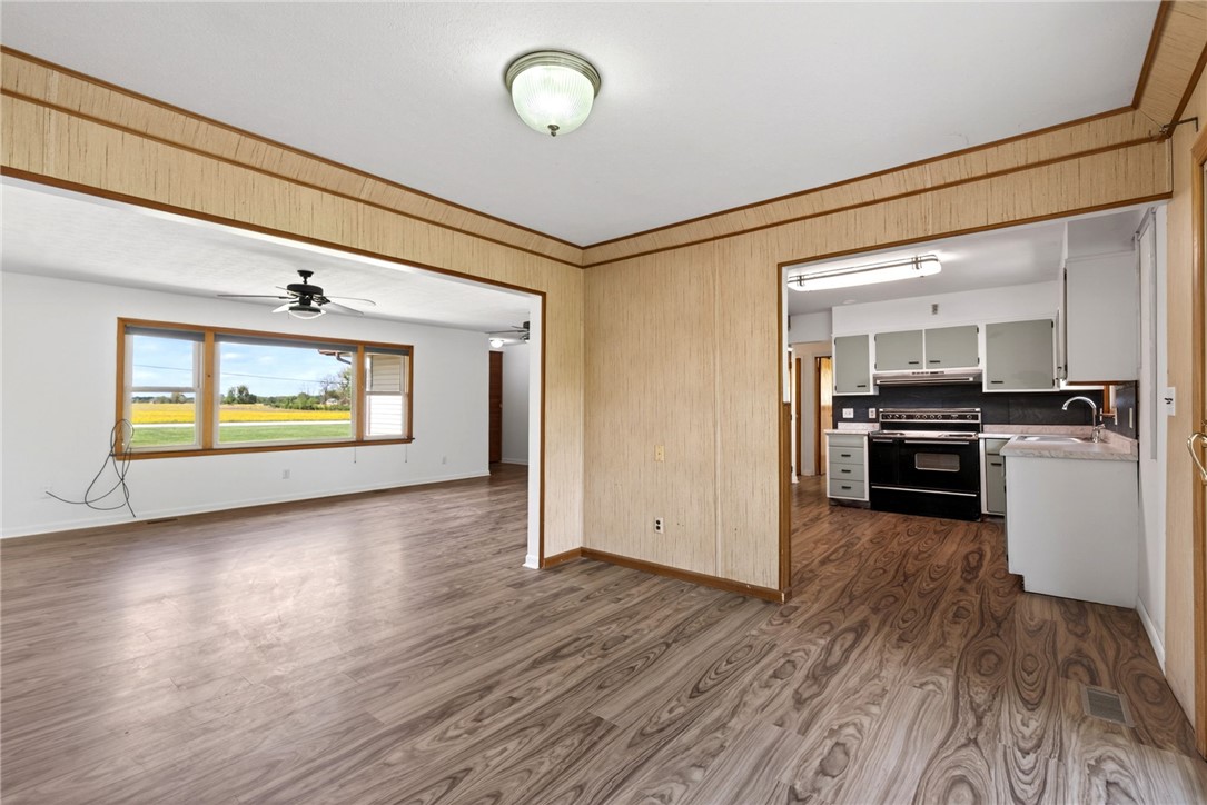1005 Free Road New Carlisle, OH 45344 - Photo 12 of 43 This inviting interior features elegant flooring and abundant natural light, creating a bright and airy atmosphere.