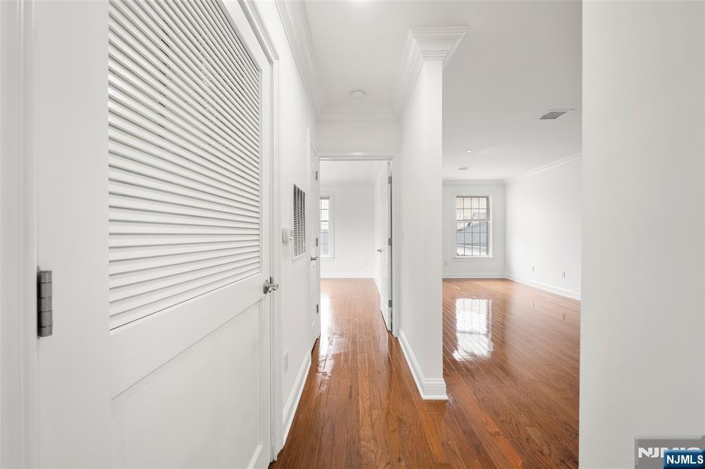 180 Edgewater Road, Unit 1A Cliffside Park, NJ 07010 - Photo 15 of 30 a view of a hallway with wooden floor