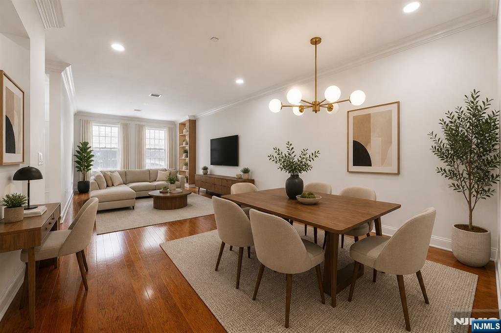 180 Edgewater Road, Unit 1A Cliffside Park, NJ 07010 - Photo 2 of 30 a view of a dining room with furniture window and wooden floor