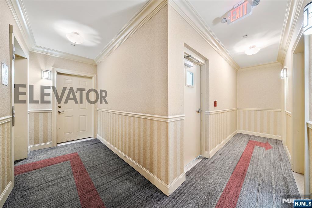 180 Edgewater Road, Unit 1A Cliffside Park, NJ 07010 - Photo 21 of 30 a view of a hallway with wooden floor and staircase