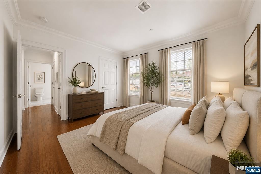 180 Edgewater Road, Unit 1A Cliffside Park, NJ 07010 - Photo 4 of 30 a bedroom with a bed window and mirror