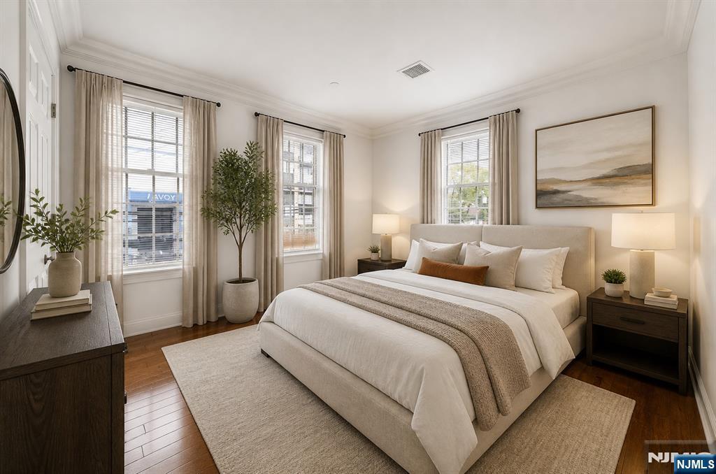 180 Edgewater Road, Unit 1A Cliffside Park, NJ 07010 - Photo 5 of 30 a bedroom with a large bed and a large window with outer view