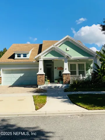 a front view of a house with garage