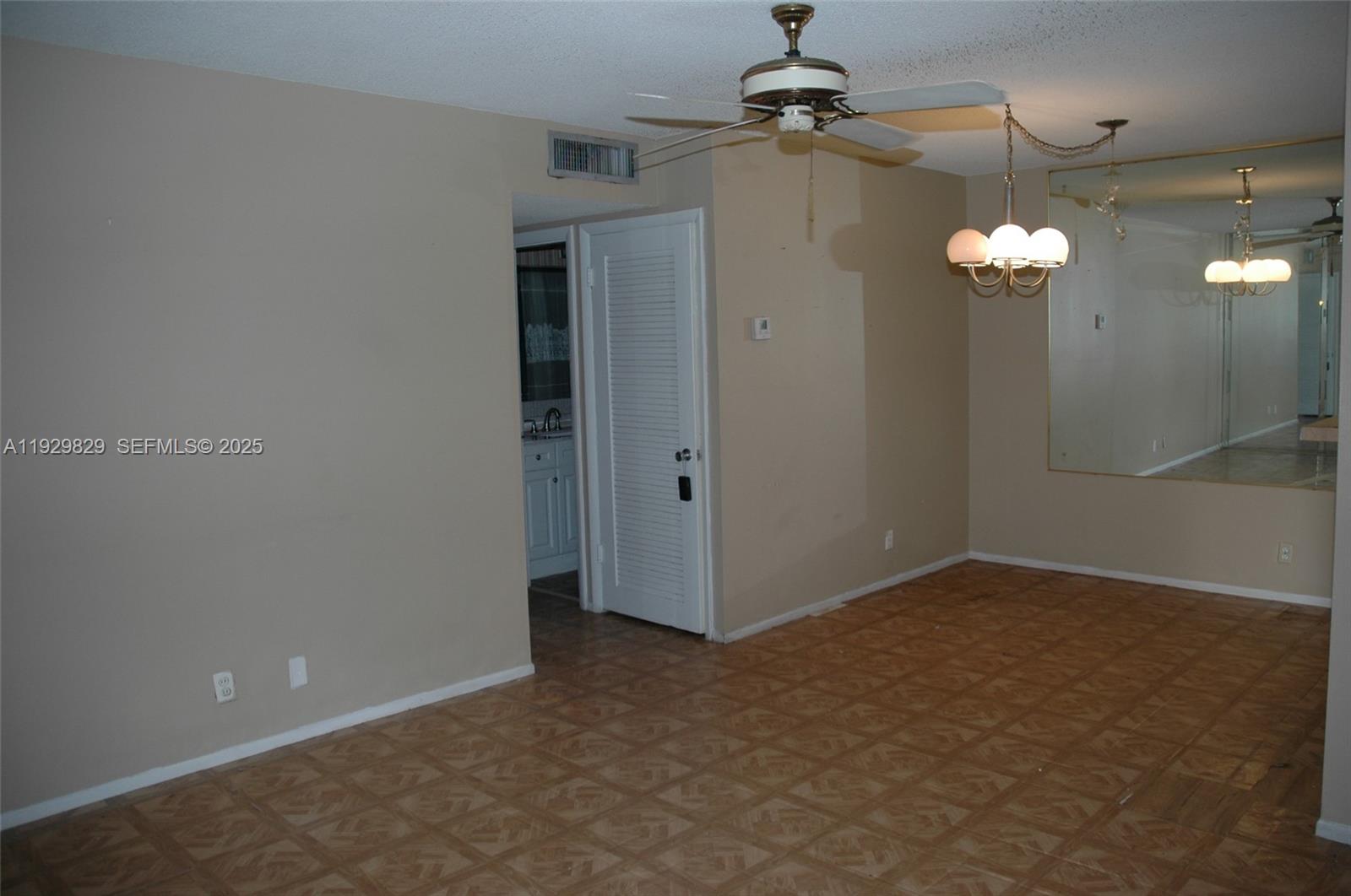 5300 Washington Street, Unit F119 Hollywood, FL 33021 - Photo 13 of 24 a view of a chandelier fan in a room