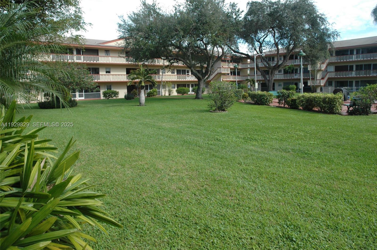 5300 Washington Street, Unit F119 Hollywood, FL 33021 - Photo 4 of 24 a view of a house with a yard and sitting area