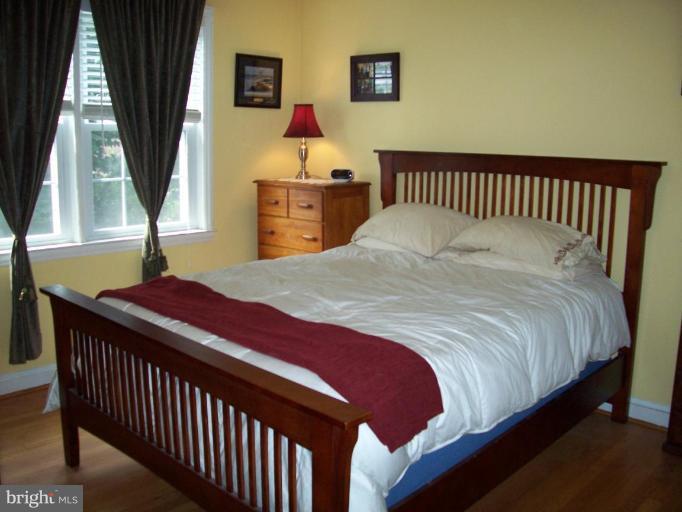 156 Dumbarton Road Baltimore, MD 21212 - Photo 14 of 14 a bedroom with bed and window