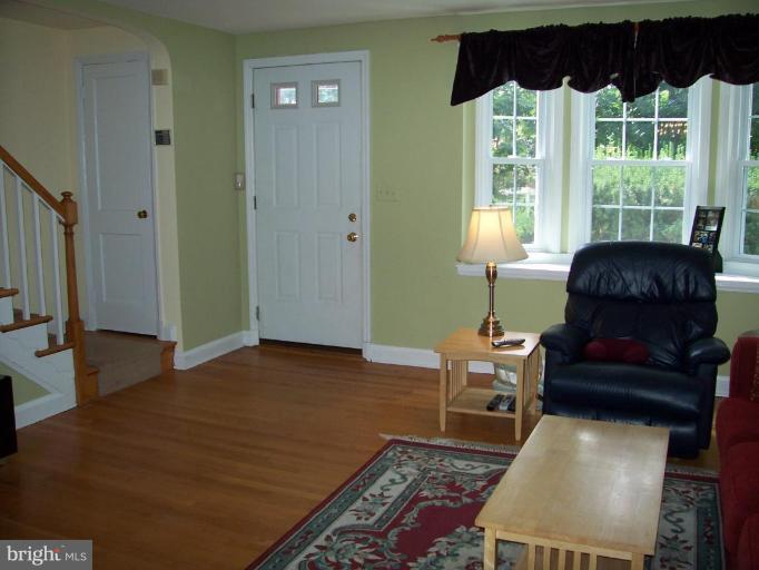 156 Dumbarton Road Baltimore, MD 21212 - Photo 3 of 14 a living room with furniture and a window