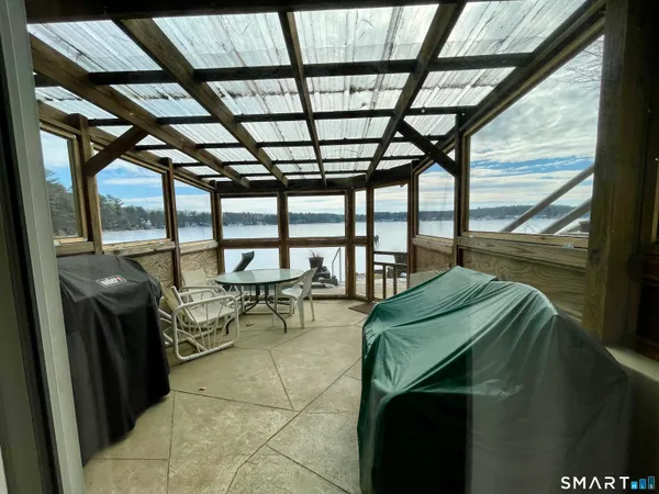 a living room with furniture gym equipment and a table