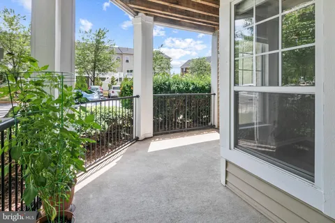a view of a glass door with a yard