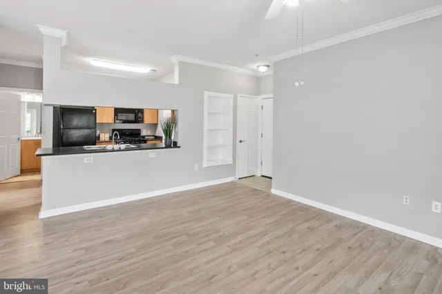 a view of a kitchen with a sink and a microwave