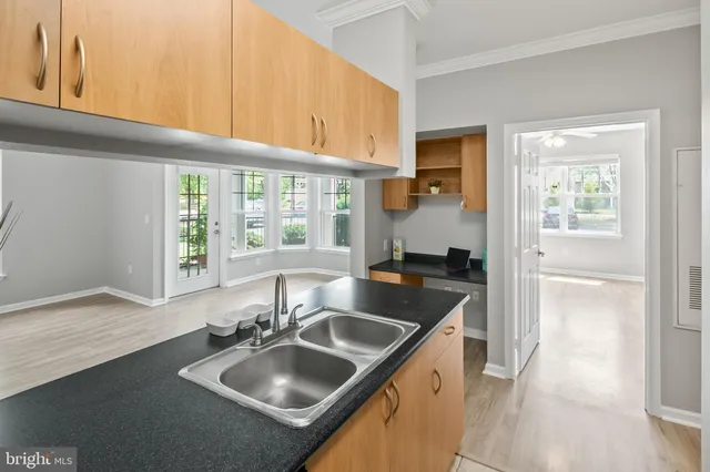 a kitchen with a sink and a window