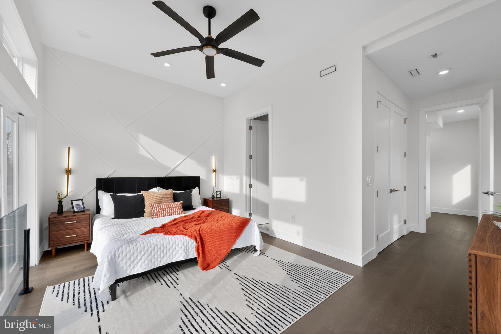 203 Church Street Wayne, PA 19087 - Photo 19 of 30 a bedroom with a bed and a chandelier