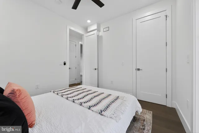 a bedroom with a bed and cabinets