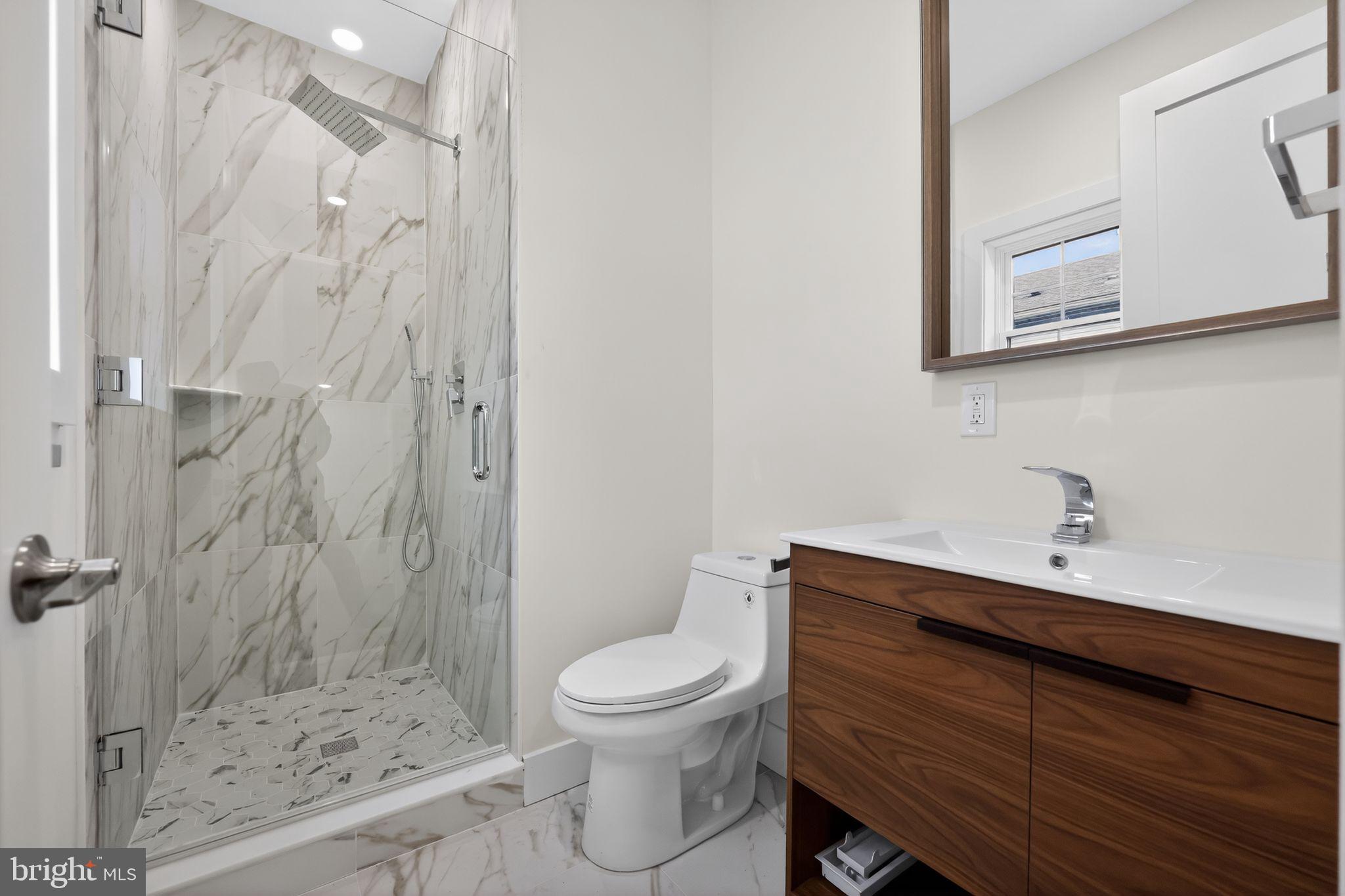 203 Church Street Wayne, PA 19087 - Photo 28 of 30 a bathroom with a sink a toilet and shower