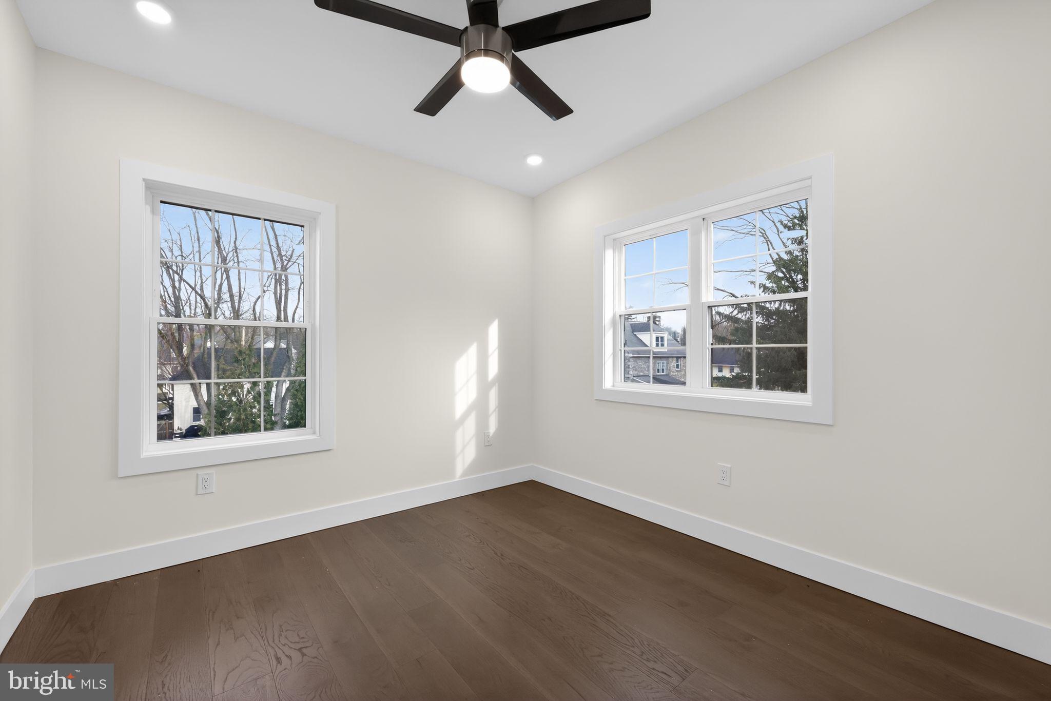203 Church Street Wayne, PA 19087 - Photo 29 of 30 a view of an empty room with wooden floor and a window
