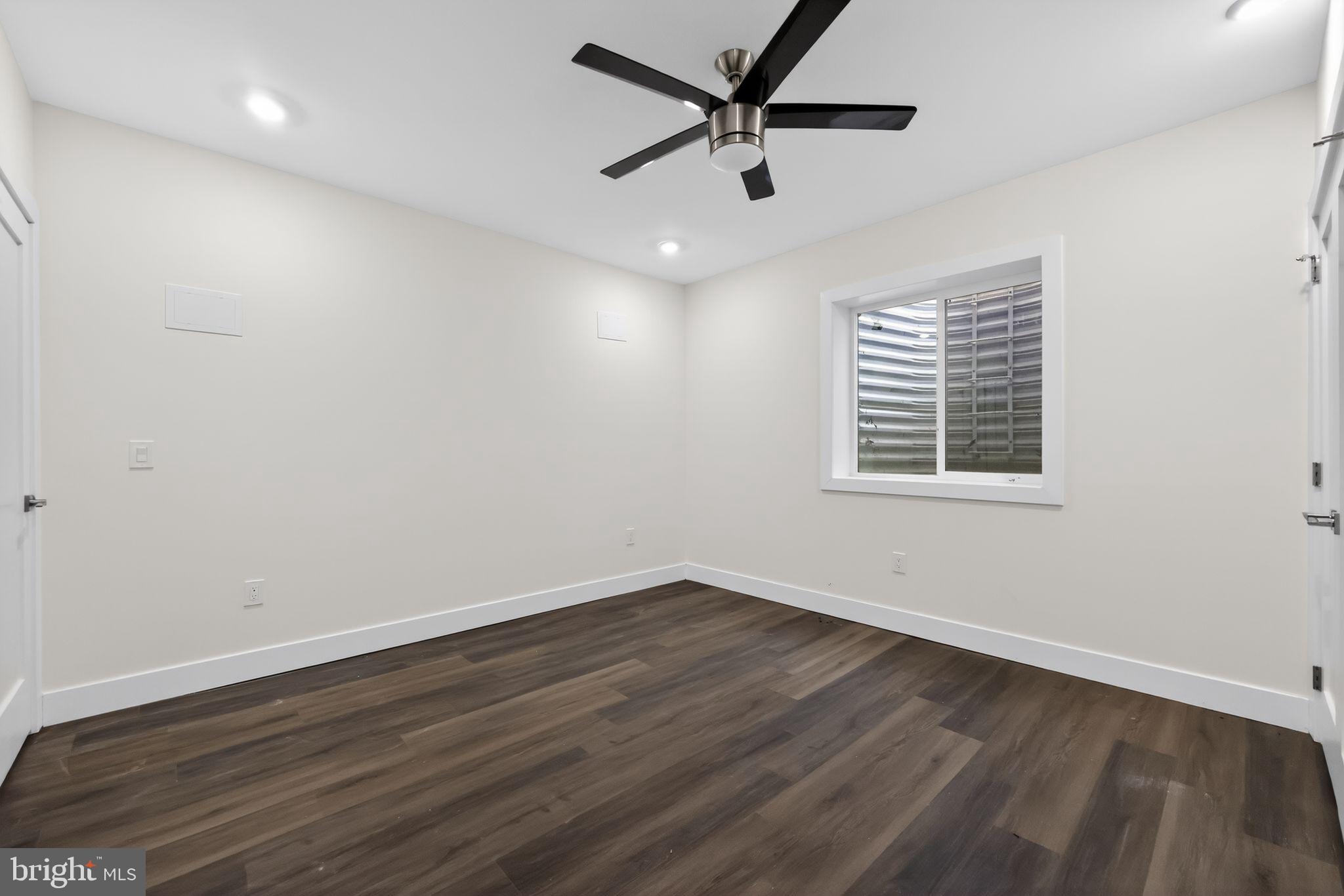 203 Church Street Wayne, PA 19087 - Photo 30 of 30 an empty room with wooden floor and windows
