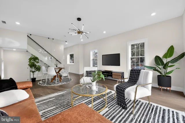 a living room with furniture or couch and a flat screen tv