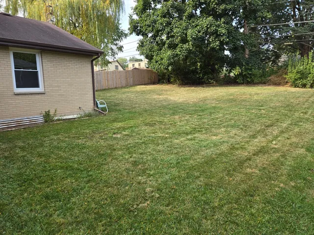 a backyard of a house with lots of green space