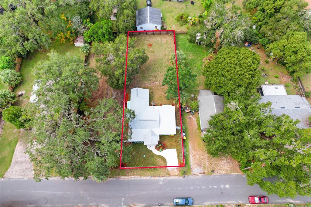 245 South Rhodes Street Mount Dora, FL 32757 - Photo 30 of 38 an aerial view of residential houses with outdoor space