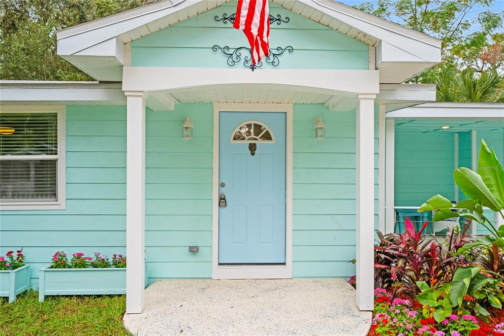 245 South Rhodes Street Mount Dora, FL 32757 - Photo 5 of 38 a front view of a house with a yard