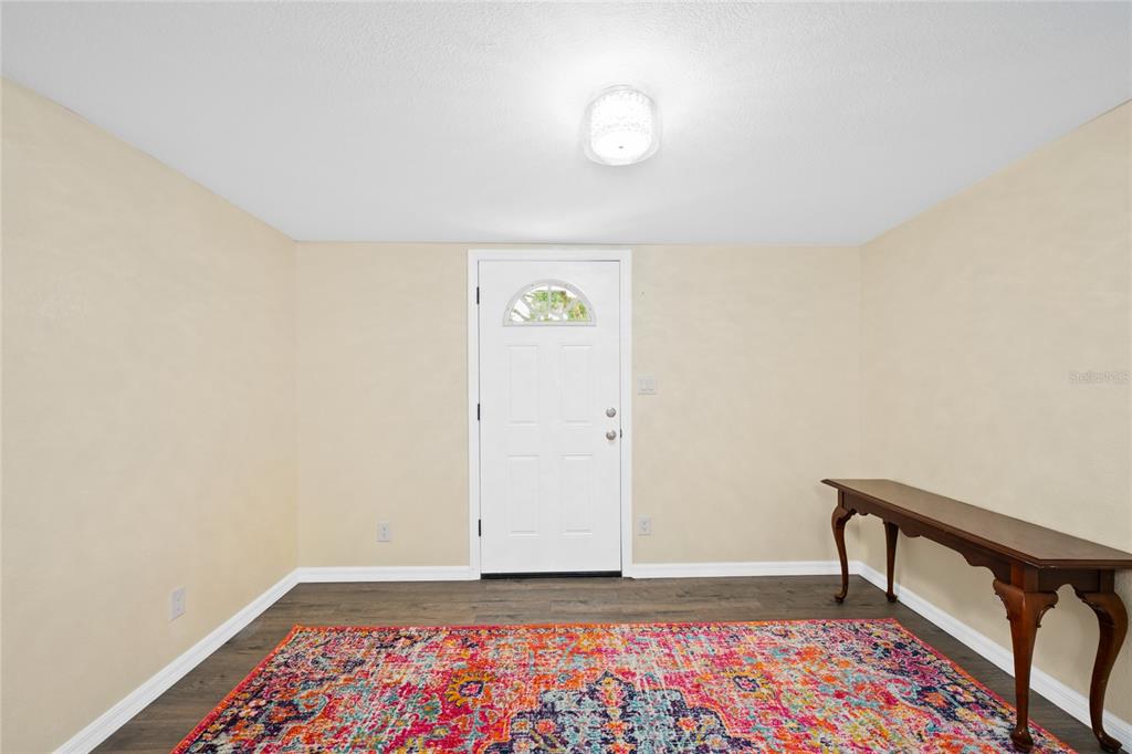 245 South Rhodes Street Mount Dora, FL 32757 - Photo 7 of 38 a view of an empty room and window