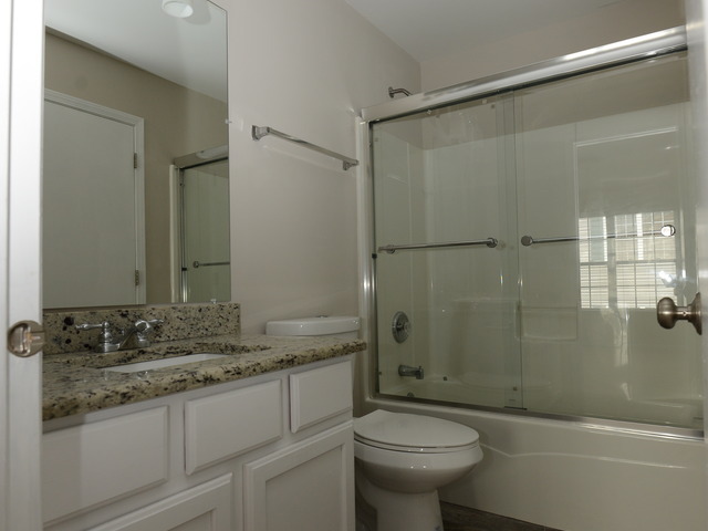 528 Wynbrooke Road Romeoville, IL 60446 - Photo 13 of 25 a bathroom with a sink and mirror with toilet