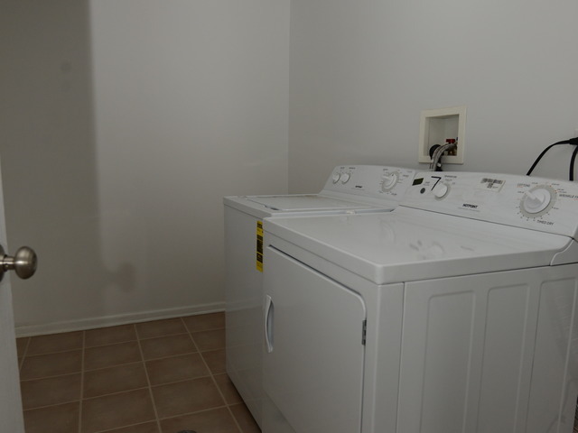 528 Wynbrooke Road Romeoville, IL 60446 - Photo 21 of 25 a utility room with dryer and washer