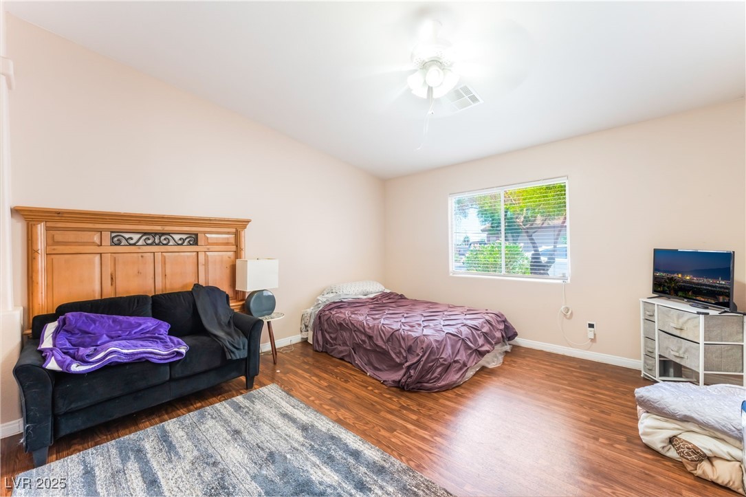 4656 East Desert Inn Road Las Vegas, NV 89121 - Photo 11 of 98 4656 E DI Bedroom with wood finished floors and ceiling fan