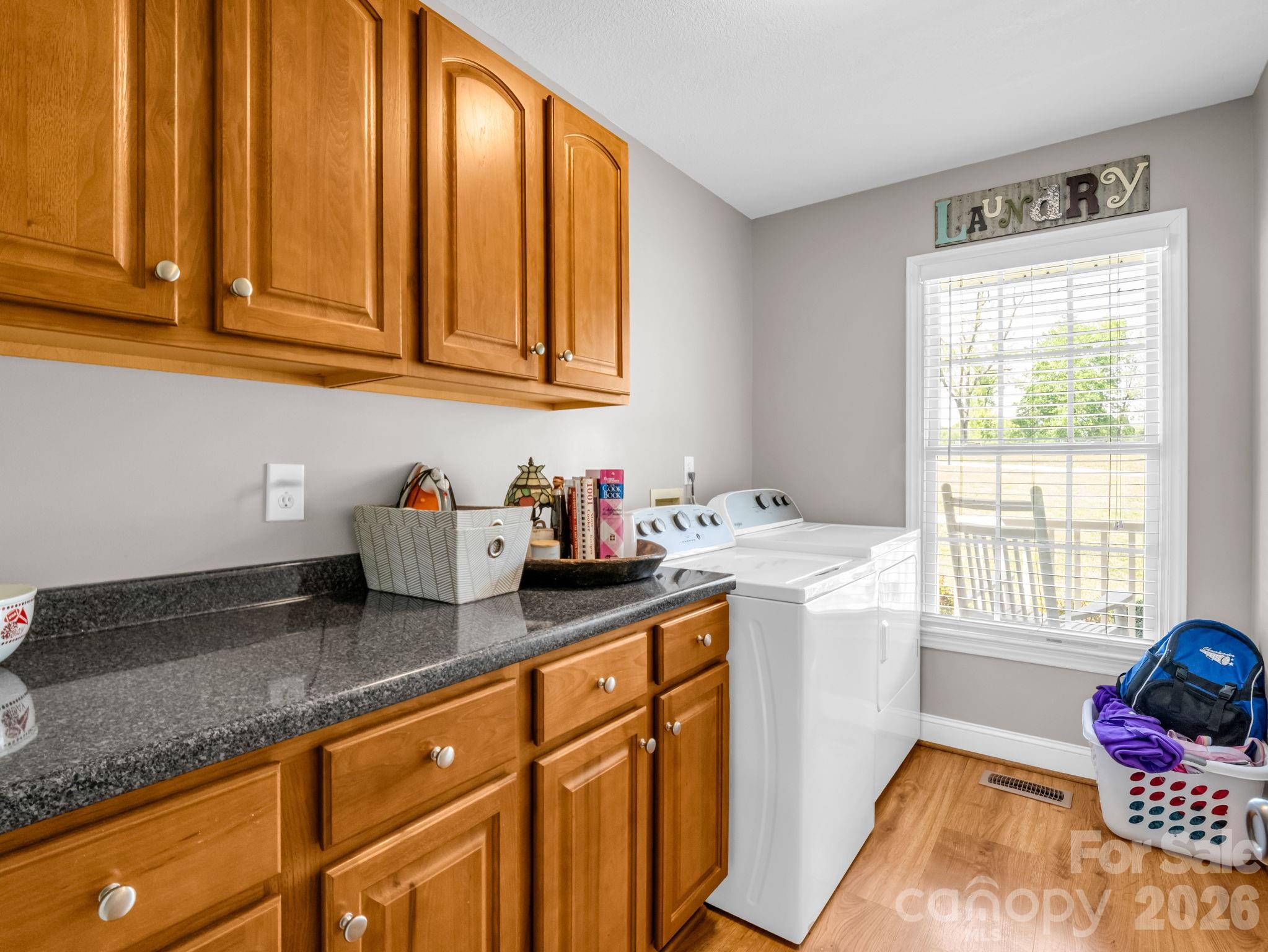 158 Shady Woods Lane Rutherfordton, NC 28139 - Photo 13 of 41 a kitchen with granite countertop stainless steel appliances a sink window and cabinets