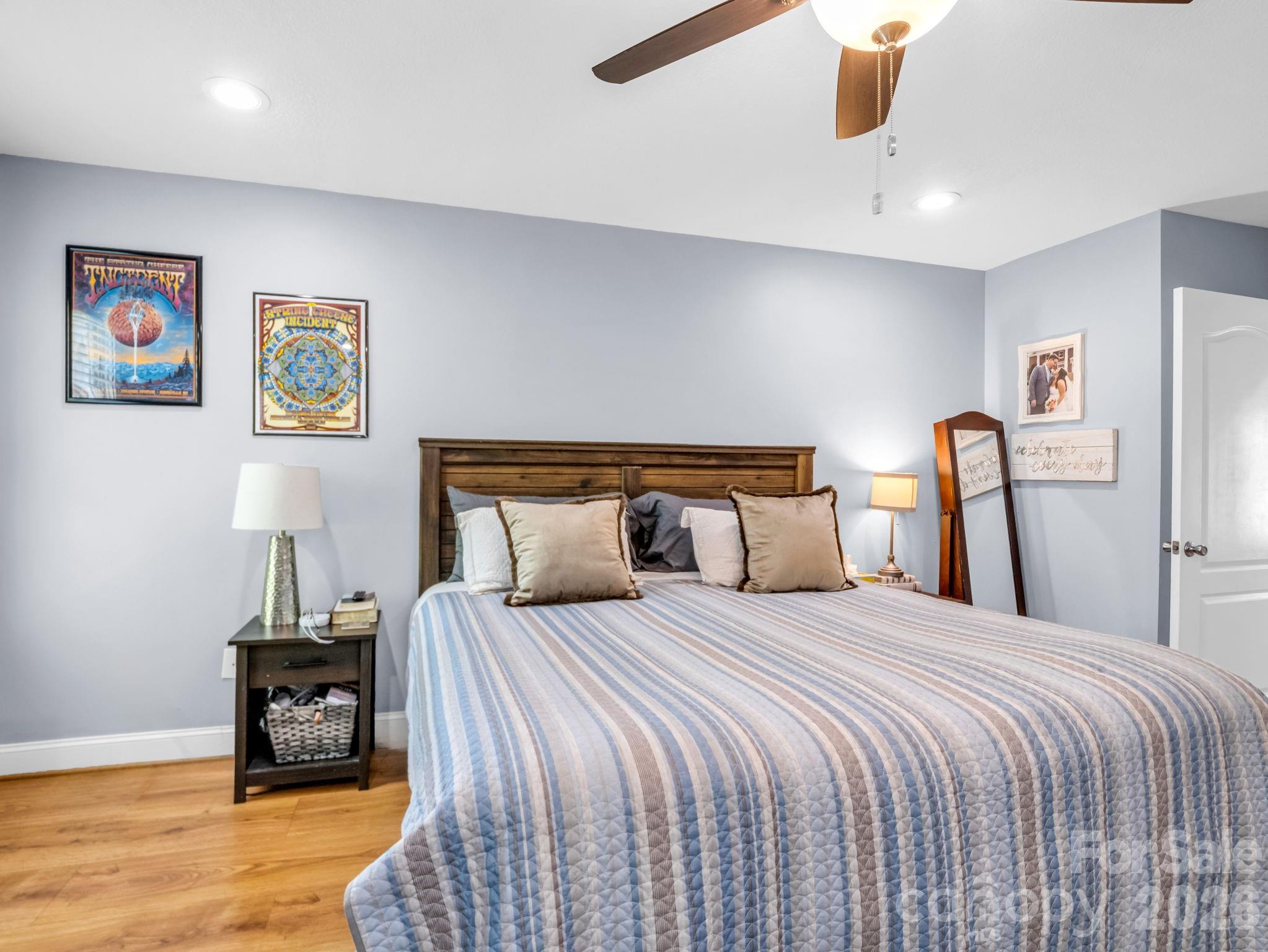 158 Shady Woods Lane Rutherfordton, NC 28139 - Photo 19 of 41 a bedroom with a bed and wooden floor