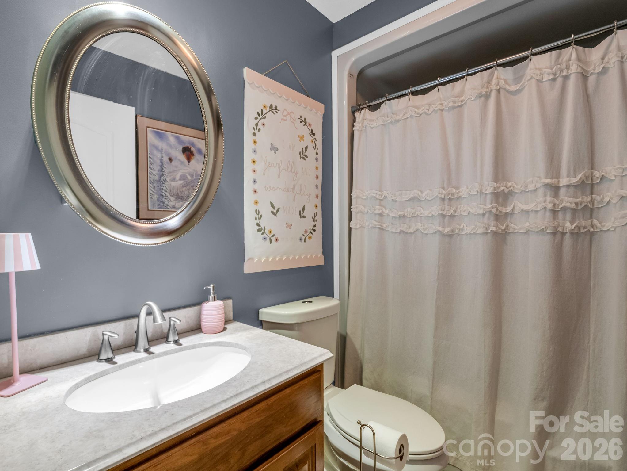 158 Shady Woods Lane Rutherfordton, NC 28139 - Photo 27 of 41 a bathroom with a granite countertop sink mirror vanity and toilet