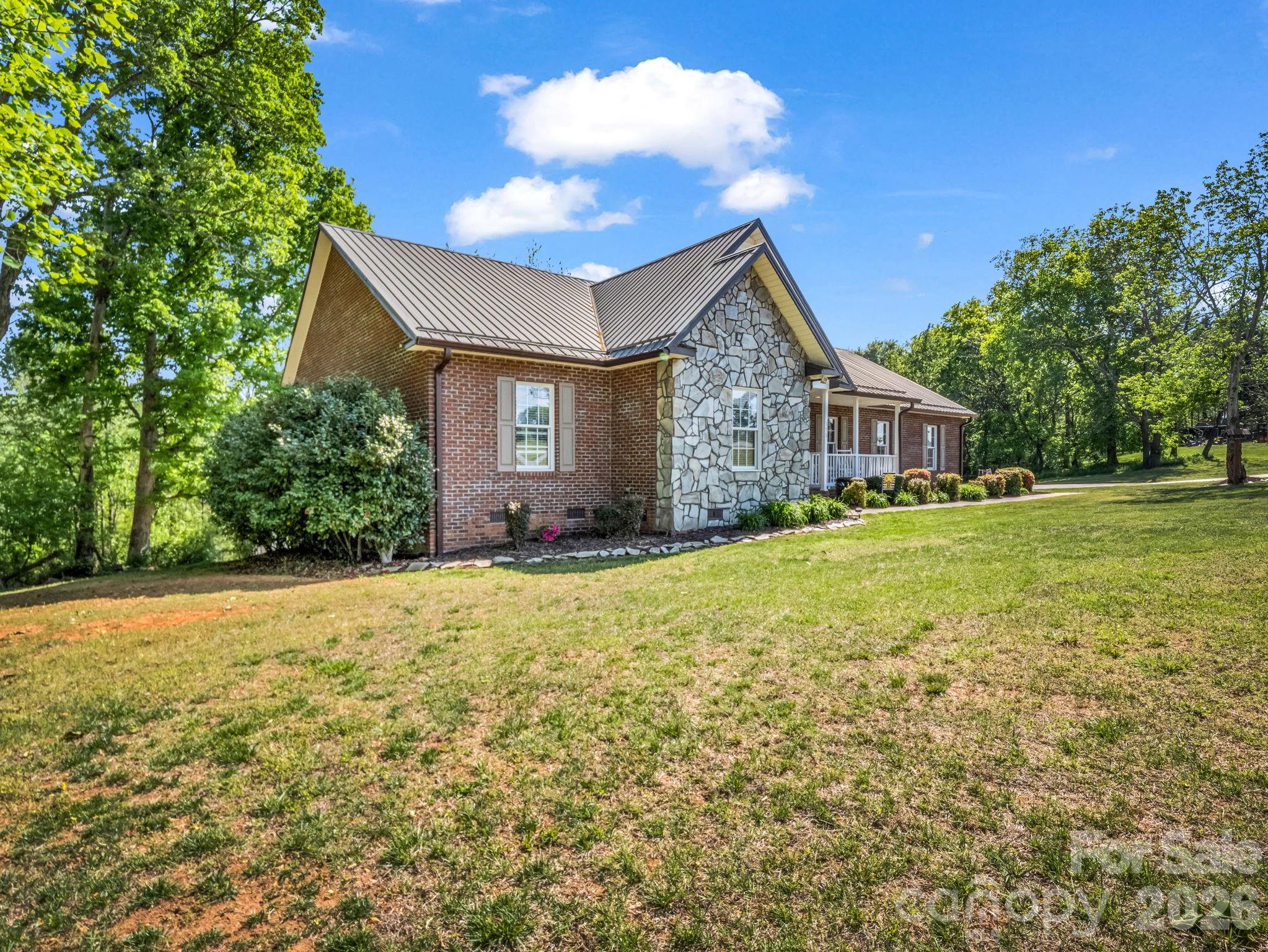 158 Shady Woods Lane Rutherfordton, NC 28139 - Photo 35 of 41 a front view of house with yard and trees around