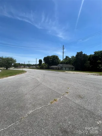 a view of a lake with houses in the background