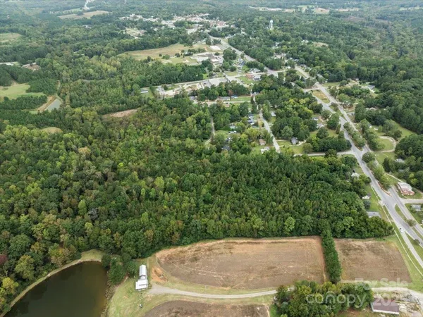 an aerial view of a house with yard
