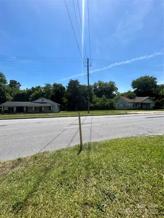 a view of pool and a yard