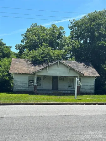 a view of a white house with a outdoor space