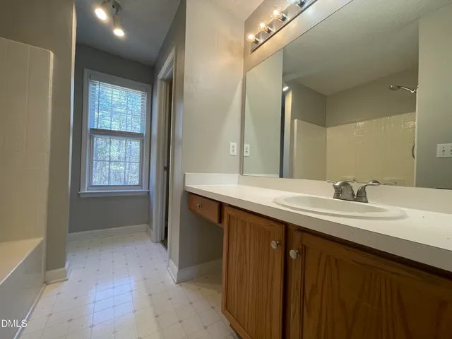 a bathroom with a toilet a sink and bathtub