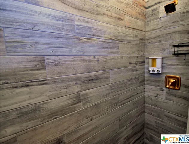 a bed room with a bed and a television