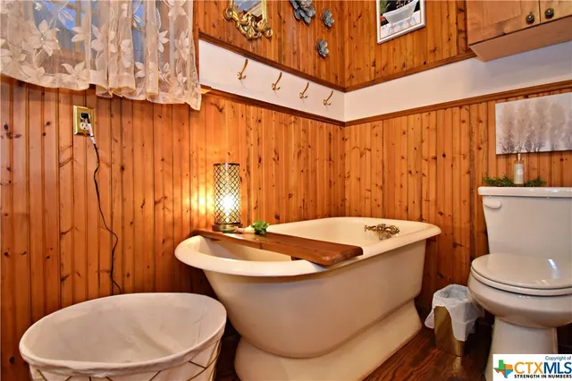 a bathroom with a toilet sink and tub