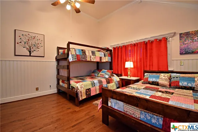 a bedroom with furniture and a window